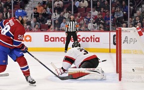 Montreal Canadiens defenceman David Savard (58) scores a goal against Ottawa Senators goalie Anton Forsberg (31) during the second period at the Bell Centre.