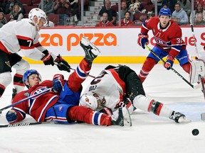 Montreal Canadiens forward Jake Evans (71) trips over Ottawa Senators defenceman Artem Zub (2) during the second period at the Bell Centre.