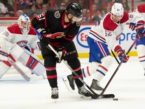 Ottawa Senators centre Derick Brassard (61) battles with Montreal Canadiens defenceman Justin Barron (52) in the second period at the Canadian Tire Centre, Oct. 1, 2022.