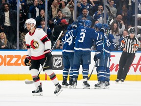 Maple Leafs centre David Kampf (64) celebrates with teammates after scoring a goal against the Senators during the second period.