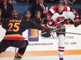 A file photo shows Justin Davis, right, in action with the Ottawa 67's during a playoff game against the Belleville Bulls in 1999.