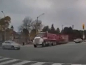 A dump truck hauling a trailer was captured on dashcam video as it T-boned an Acura in the intersection of Markham Rd. and Elson St. killing two siblings and critically injuring their mom on Wednesday, Oct. 12, 2022.