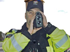 Files: A 'constable scarecrow' cutout of an officer holding a radar gun. The Ottawa Police Service announced that 117 speeding tickets were issued during the holiday weekend.