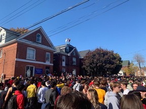 Thousands of people gather on Aberdeen Street in Kingston for the annual "Fake-Homecoming" on Saturday.