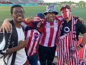 Atletico Ottawa super fans Brandon Adibe, Marco Mendoza, Eddie Benhin and Bryce Crossman are part of the passionate support in section W at TD Place.