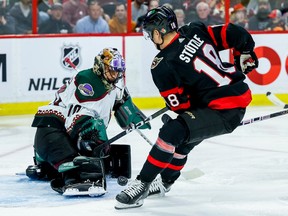 Senators centre Tim Stutzle is stopped by  Coyotes goaltender Karel Vejmelka on a scoring attempt in the first period.