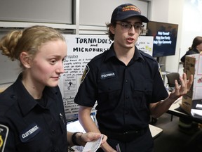 Renée Clutterbuck, left, and Taeg O'Gorman give a presentation on tornadoes and microbursts at Algonquin College on Monday.