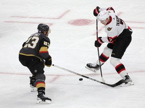 Brady Tkachuk #7 of the Ottawa Senators skates with the puck against Alec Martinez #23 of the Vegas Golden Knights in the second period of their game at T-Mobile Arena on November 23, 2022 in Las Vegas.
