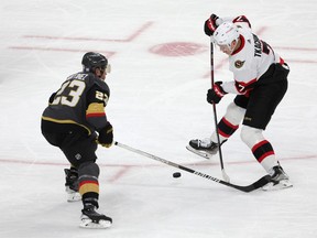 Brady Tkachuk #7 of the Ottawa Senators skates the puck against Alec Martinez #23 of the Vegas Golden Knights during the second period of the game at T-Mobile Arena on November 23, 2022 in Las Vegas.