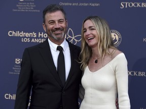 Jimmy Kimmel, left, and Molly McNearney arrive at the 2022 Children's Hospital Los Angeles Gala, Saturday, Oct. 8, 2022, at Barker Hanger in Santa Monica, Calif.