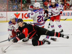 Ottawa Senators left wing Brady Tkachuk (7) and New York Rangers defenceman Braden Schneider battle during first-period NHL action at the Canadian Tire Centre on Wednesday, Nov. 30, 2022.