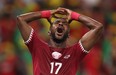 Qatar's Ismail Mohamad reacts after a missed chance to score.