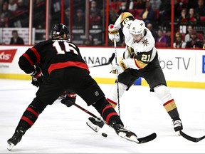 Golden Knights’ Brett Howden (right) controls the puck against Senators’ Austin Watson last night.