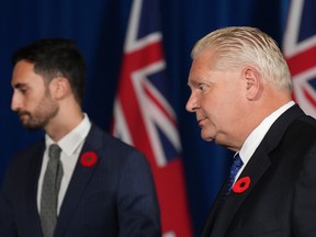 Ontario Premier Doug Ford, right, and Education Minister Stephen Lecce leave after a press conference at Queen's Park in Toronto on Monday, Nov. 7, 2022.