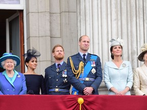 Queen Elizabeth II, Meghan, Duchess of Sussex, Prince Harry, Duke of Sussex, Prince William Duke of Cambridge and Catherine, Duchess of Cambridge watch the RAF 100th anniversary flypast from the balcony of Buckingham Palace on July 10, 2018 in London, England. (Photo by Paul Grover - WPA Pool/Getty Images)