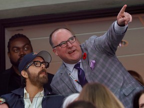 Ryan Reynolds talking to Ottawa Senators President of Business Operations Anthony LeBlanc during the first period Tuesday.