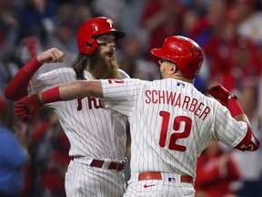 Phillies left fielder Kyle Schwarber (12) celebrates with centre fielder Brandon Marsh (16) after hitting a two-run home run against the Astros during the fifth inning in Game 3 of the 2022 World Series at Citizens Bank Park in Philadelphia, Tuesday, Nov. 1, 2022.