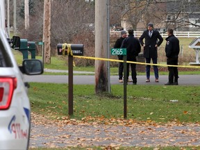 Kingston Police detectives and forensic officers gather outside a home on McKendry Road Tuesday morning, just south of Unity Road after a sudden death took place in a home on Monday November 15, 2022.