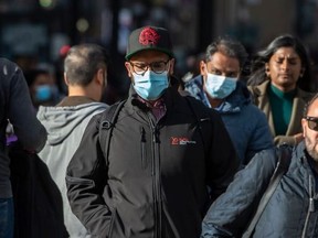 Pedestrians wearing masks.