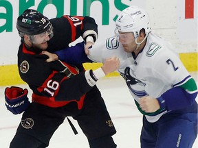 Ottawa Senator Austin Watson fights Vancouver Canuck Luke Schenn during the second period.