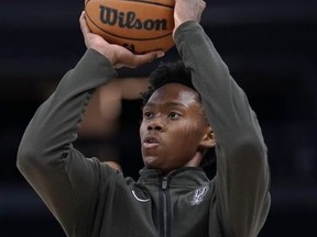 San Antonio Spurs guard Joshua Primo warms up before an NBA basketball game against the Minnesota Timberwolves, Monday, Oct. 24, 2022, in Minneapolis.