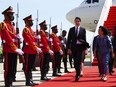 Prime Minister Justin Trudeau is greeted by Cambodia's Minister of Women's Affairs Ing Kantha Phavi as he arrives in Phnom Penh, Cambodia on Saturday, Nov. 12, 2022, to attend the ASEAN Summit.