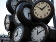 A giant sculpture constructed with the faces of clocks is seen outside a Paris train station, March 27, 2009 on the weekend when France moves its clocks forward one hour early Sunday morning, marking daylight savings time.