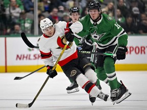 Ottawa Senators right wing Alex DeBrincat (left) and Dallas Stars centre Ty Dellandrea jostle during the second period at the American Airlines Center in Dallas on Dec. 8, 2022.