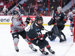 Hannah Brandt #20 of Team Poulin battles with Jaime Bourbonnais #14 of Team Nurse during the PWHPA all-star game at the Canadian Tire Centre on December 11, 2022 in Ottawa.