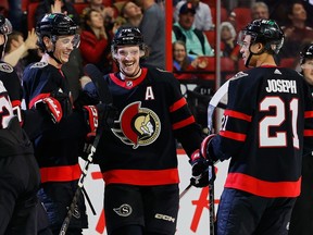 Every time the Ottawa Senators' Thomas Chabot (centre) gets a goal or an assist in the month of December, he'll make a contribution to the Moisson Outaouais — a food bank in Gatineau.