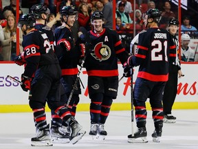 Ottawa Senators defenceman Thomas Chabot (wearing A) smiles as he is congratulated by teammates for his goal against the San Jose Sharks during third period NHL action at the Canadian Tire Centre on Saturday, Dec. 3, 2022.