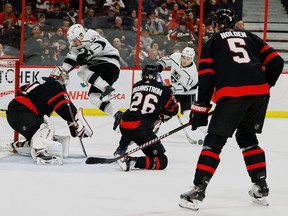 Sayap kanan Los Angeles Kings Viktor Arvidsson (33) melompat saat sayap kiri Trevor Moore (12) menembak penjaga gawang Senator Ottawa Anton Forsberg (31) selama aksi NHL periode kedua di Canadian Tire Center pada Selasa, 6 Desember 2022.