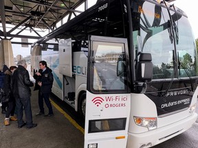 An Orléans Express bus is pictured taking passengers from the Ottawa train station.