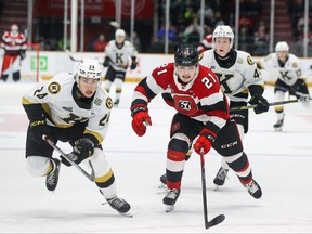 Ethan Quick of the Ottawa 67’s chases down a loose puck against Kingston’s Thomas Budnick yesterday at TD Place.