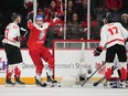 Czechia's Jaroslav Chmelar, centre, celebrates a goal in front of Canada's Jack Matier, left, and Colton Dach.