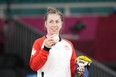 Catherine Beauchemin-Pinard of Canada celebrates with her bronze medal for the women -63kg judo match at the 2020 Summer Olympics in Tokyo, Japan, Tuesday, July 27, 2021.