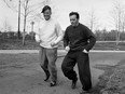 French singer Maurice Chevalier (L) jogs with French boxer Marcel Cerdan in New-York in 1947. (Photo by ERIC SCHWAB/AFP via Getty Images)
