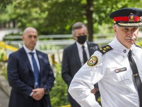 Toronto Police Chief James Ramer, joined by Toronto Police Association President Jon Reid (left) and Mayor John Tory outside Toronto City Hall on Friday, July 2 2021.