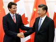 FILE PHOTO: Chinese President Xi Jinping (R) shakes hands with Canadian Prime Minister Justin Trudeau ahead of their meeting at the Diaoyutai State Guesthouse in Beijing, China Aug. 31, 2016.