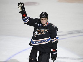 Washington Capitals left wing Alex Ovechkin  waves as he continues to celebrate his goal during the third period against the Winnipeg Jets in Washington on Friday, Dec. 23, 2022. It was Ovechkin's 802nd NHL goal.