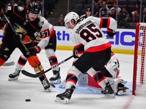 A photo from a Nov. 25 game in Anaheim shows Senators defenceman Jake Sanderson (85) helping defend the goal against Ducks left-winger Max Jones.