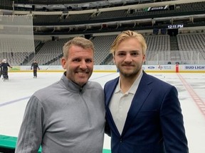 Niklas Brannstrom, left, and his son, Erik Brannstrom, a Senators defenceman, pose for a photo at American Airlines Center in Dallas on Thursday morning.