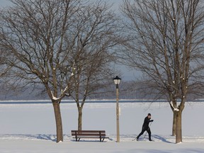 A cross country skier enjoys the warmer temperatures near Britannia Park in Ottawa Dec. 29, 2022. Temperatures are forecast to rise as high as 7 C on the weekend.