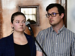 American couple Nicholas Spencer and his wife, Mackenzie Leigh Mathias Spencer, both 32, stand in the dock at Buganda road court, where they were charged with torturing John Kayima in Kampala, Uganda, Dec. 14, 2022.