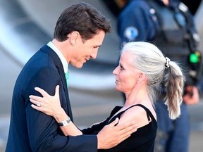 Canadian Prime Minister Justin Trudeau (left) greets Canadian Ambassador to France Isabelle Hudon as he arrives in Biarritz, southwest France, on Aug. 23, 2019, on the eve of the annual G7 Summit.