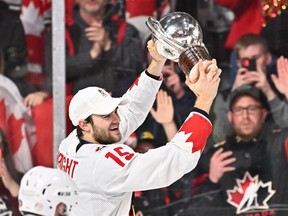 Canadian team captain Shane Wright skates with the IIHF world junior hockey championship trophy after Thursday's overtime win against the Czech Republic in Halifax.