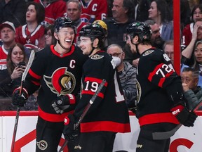 Brady Tkachuk, left, and Jake Sanderson (not in picture) made a wager with teammates Drake Batherson and Thomas Chabot about the result of the world junior semifinal between Canada and the U.S. in Halifax on Wednesday.