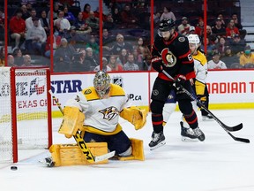 Ottawa Senators center Derick Brassard (61) and Nashville Predators defenseman Ryan McDonagh (27) watch as goaltender Juuse Saros (74) makes another save, resulting in the Sens' first shutout of the season.