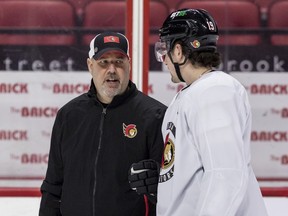-OTTAWA- Ottawa Senators assistant coach Bob Jones (L) talks with right wing Drake Batherson during team practice at the Canadian Tire Centre on January 24,2023. Jones has been diagnosed with ALS. ERROL MCGIHON/Postmedia