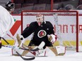 Ottawa Senators goaltender Cam Talbot makes a blocker save during team practice at the Canadian Tire Centre on Jan. 24, 2023.